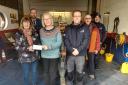 Hazel James hands over the cheque for £205 to Fishguard and Goodwick RNLI fundraiser, Sylvia Hotchin. Crew members Warren Bean, Steve Grant and Chris Thomas were also present as well as Hazel's husband Richard.