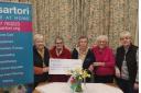 The Paul Sartori Foundation's first registered nurse, Carmel Gould, is pictured (centre) receiving the Eglwyswrw Village Association cheque from committee chair Mandy Phil,lips (left) and committee members Eileen Thomas, Tricia Fox and Mair Harries.