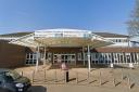 A woman has admitted assaulting two police officers and a healthcare support worker at Withybush Hospital.