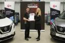 CAPTION: Lewis Thomas is presented with his winner’s certificate at the Doncaster event by Catherine Hogarty, Nissan Academy GB Manager.