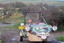 Buzz Knapp-Fisher, artist and environmental activist and the three -wheeler he made (1999).