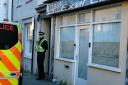Police outside property in Upper Market Street, Haverfordwest, yesterday.