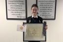Elly Neville is pictured with her Pupil of the Year award.
