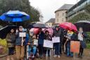 Stop the Stink campaigners braved the rain outside County Hall, Haverfordwest, today to demand that the problem is fixed.