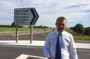 WHERE’S PENDINE?:  Simon Hart MP at the Red Roses junction off the new by-pass.  He and the community council are working together to improve signage and safety at the junction. (9389123)