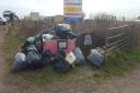 Mounds of rubbish at a National Trust beauty spot have been left there for six months.
