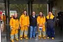 Cllr Wynne Evans is pictured with Tenby lifeboat crew members after making his donation