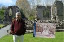 The heritage trail’s author, Mark Muller, pictured at the Priory Ruins. Inset, the trail’s front cover: a previously unpublished work by an unknown German prisoner of war done in 1948. Courtesy of Angela Gwyther.