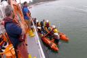The paramedic and Tenby lifeboat volunteer crew were dropped ashore by the inshore lifeboat, where they were met by Caldey fire crew