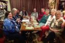 Joan Giles, third from right, is pictured with supper guests at the annual Pies, Pints & Tarts.