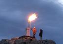 Mike Kurtz lighting the beacon at Garn Fawr