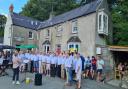 Whitland Male Choir is pictured at its summer barbeque at Cresswell Quay