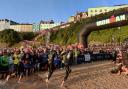 The Ironman Wales swim start at sunrise is one of the iconic moments of the event.