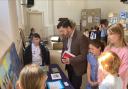 Stephen Crabb MP with pupils from Broad Haven School at their climate injustice exhibition in Broad Haven Chapel.