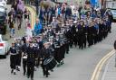The crew of HMS Pembroke and local sea cadets parade through the town.