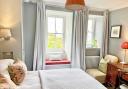 A sea-view bedroom at ManorTown House.