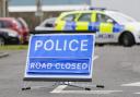 The A487 was closed after the two-car crash
