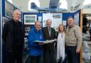 Centenarian Hugh Langrishe is welcomed to  Pembroke Dock Heritage Centre by Patron John Evans. With them are, left to right: Cliff Morris, Julie Cavanagh and Jack Langrishe.