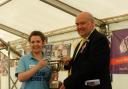 Fishguard YFC chairman Jill Luke-Evans receives the ER Phillips Award from Pembrokeshire YFC President Alwyn Evans. picture: Western Telegraph.