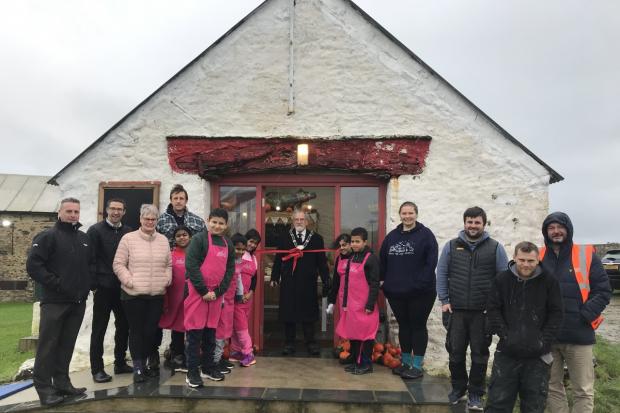 Children from Selwyn Primary School with Jewson's Ian Lewis, Andrew Wilson and Andrew McNabney, Lower Treginnis' Sue Ford, Dan Jones and Fiona Day, Counsellor Allan York, St Davids Mayor and Christopher James and Carl Palmer of C James Carpentry &