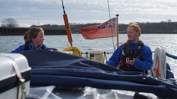 Western Telegraph: Lowri (right) and first mate Elin are looking to make history in the Royal Western Yacht Club Round Britain and Ireland Race 2022. Photo Aron Mathias-Weston