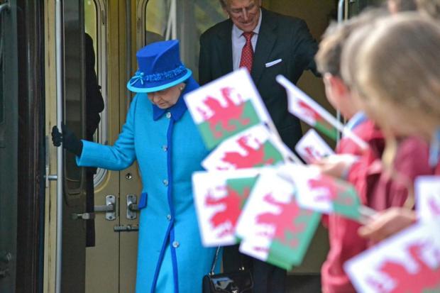 Western Telegraph: Queen Elizabeth and Prince Philip exiting the Royal Train as it stops in Haverfordwest