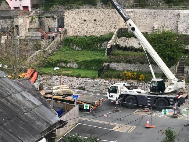 Western Telegraph: A keystone being moved into position at Haverfordwest Castle