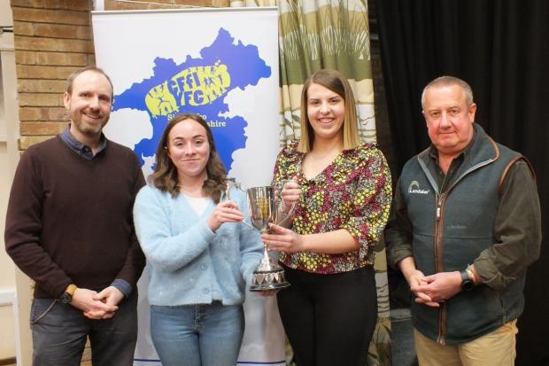 Fishguard YFC are presented the Hylton John Trophy for the Best Overall Performance. Pictured are Rhodri Evan John, adjudicator, with Teleri Wilson and Cariann Griffiths, Fishguard YFC, and Jeremy Bowen Rees from Landsker Business Solutions.