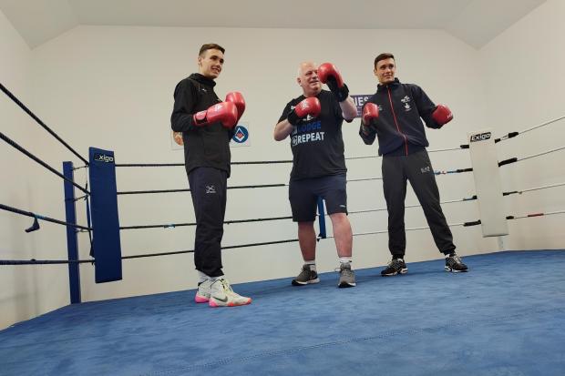 Boxing clever: James Ross, Leader of the West Wales Masons, gets into the ring with GB stars Ioan and Garan Croft.