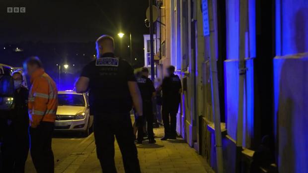 Western Telegraph: Officers at the scene on Hamilton Terrace. Picture: BBC