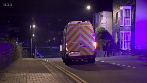 Western Telegraph: A police van leaving the scene. Picture: BBC