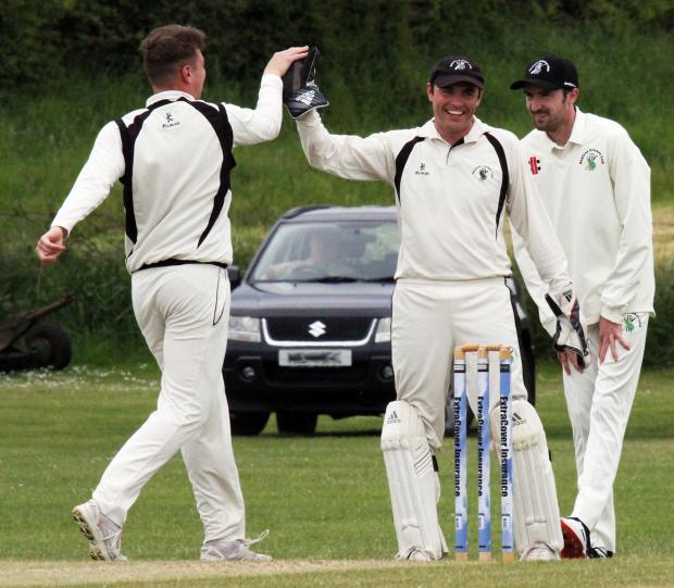 Western Telegraph: Neyland bowler Jamie Smith celebrates Sean Hannon's superb catch behind the wicket to dismiss Rhys Davies