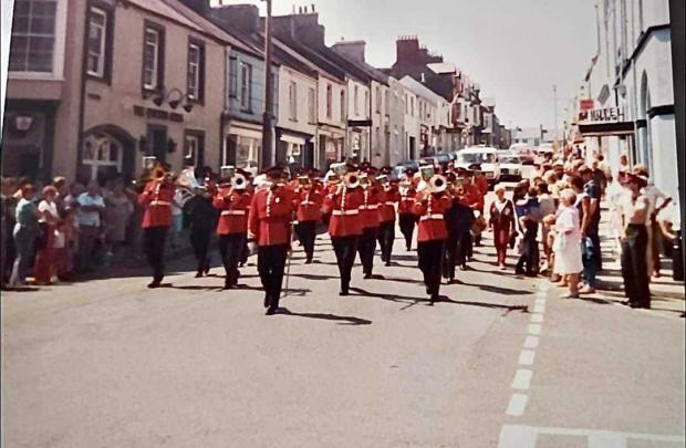 Western Telegraph: Pembroke Dock carnival with Queens Arms marching in 1980s. Picture: Nerys Butland
