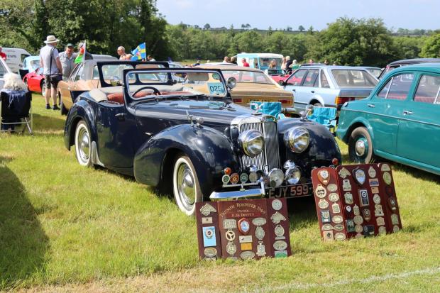 Western Telegraph: Peter Badham, club secretary, then presented a silver platter to Anthony Coles of Cardiff for best car in the show for his fantastic Morris Minor Convertible