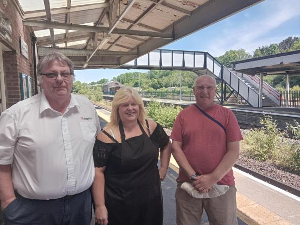 Western Telegraph: Brian Dullaghan, (right) has had to cancel anniversary celebrations because of the strikes. Also pictured is Kay Davies and ticket officer Jim Mills who has sympathy for the strikers