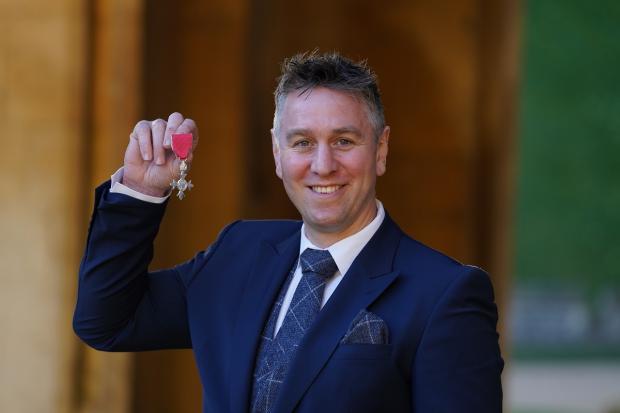 Western Telegraph: Ryan Jones was awarded an MBE at Windsor Castle in February 2022 for services to rugby and charity. Picture: Steve Parsons/PA Wire