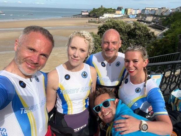 Western Telegraph: Tenby Aces Colin and Bev Barratt, Ian and Helena Warne and Will Lewis shared the delights of sea-swimming with the star. Picture: Helena Warne
