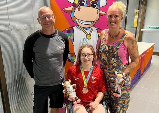 Western Telegraph: Lily with her parents after picking up the bronze medal