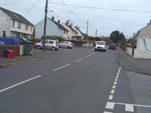 Western Telegraph: Police leaving the scene of the assault in Goodwick on April 5
