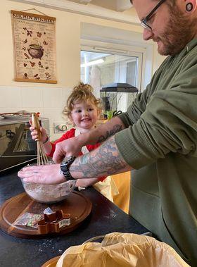 Western Telegraph: Oswyn and her dad getting to work in the kitchen. Western Telegraph: Oswyn and her dad getting to work in the kitchen.