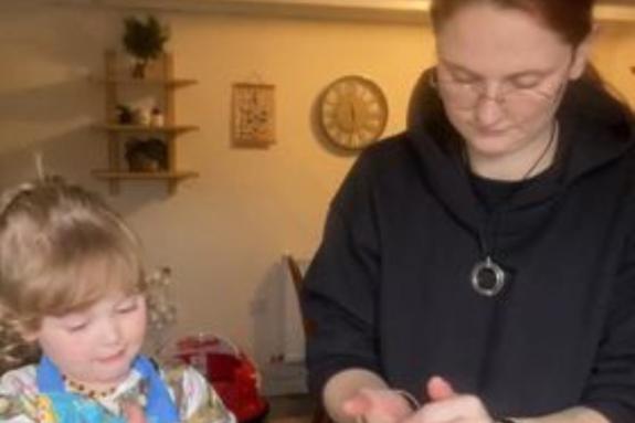 Western Telegraph: Oswyn and her mum Madison cooking together in the kitchen. Western Telegraph: Oswyn and her mum Madison cooking together in the kitchen.