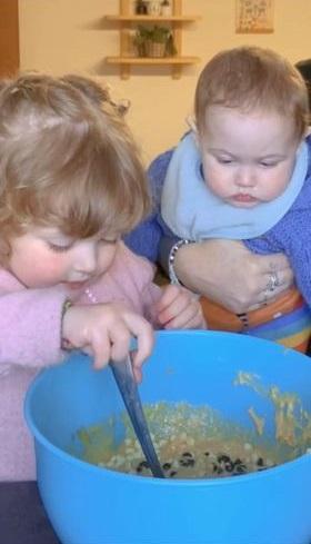 Western Telegraph: Oswyn showing her 9-month old brother Jai how to mix. Western Telegraph: Oswyn showing her 9-month old brother Jai how to mix.