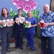 Birthday celebrations for the TLC at Withybush Hospital, where the head of West Wales Freemasons, James Ross and Red Teddy are pictured with A&E consultant Nicola Drake, Senior Sister Andrea Williams and Emergency Nurse Practitioner Andrea Owens