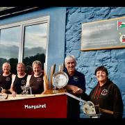 Candy's Lads with 40-year-old boat the Margaret and their three winners' trophies from Cork. Picture: Richard Grosvenor