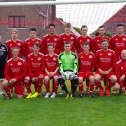 West Dragons in 2013 wearing a new football kit supplied by Haverfordwest business Dial A Curry..
