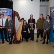 Overall winner, harpist Eliza Bradbury, is pictured with the open competition winners Dylan Sanders-Swales, Carys Wood, Jenifer Rees, Heledd Richardson and Anya Beynon-Krampf, with Stephen Thornton of Valero  and Music Service manager Philippa Roberts.