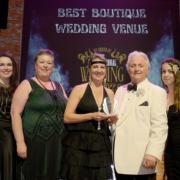 The team at Wolfscastle eceived their accolade from fashion designer, David Emmanuel