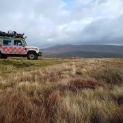 Mountain Rescue teams use drone to try and find walkers lost in clouds in Powys
