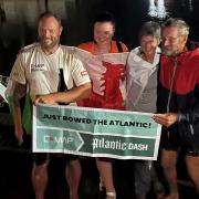 Atlantic Dragons Adrian and Dan with their loved ones . The pair have rowed 3,200 miles across the Atlantic Ocean, finishing in Antigua.
