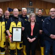 St Davids RNLI volunteers are presented with the award by Head of Region Jo Partner.. Picture:  Martin Cavaney
